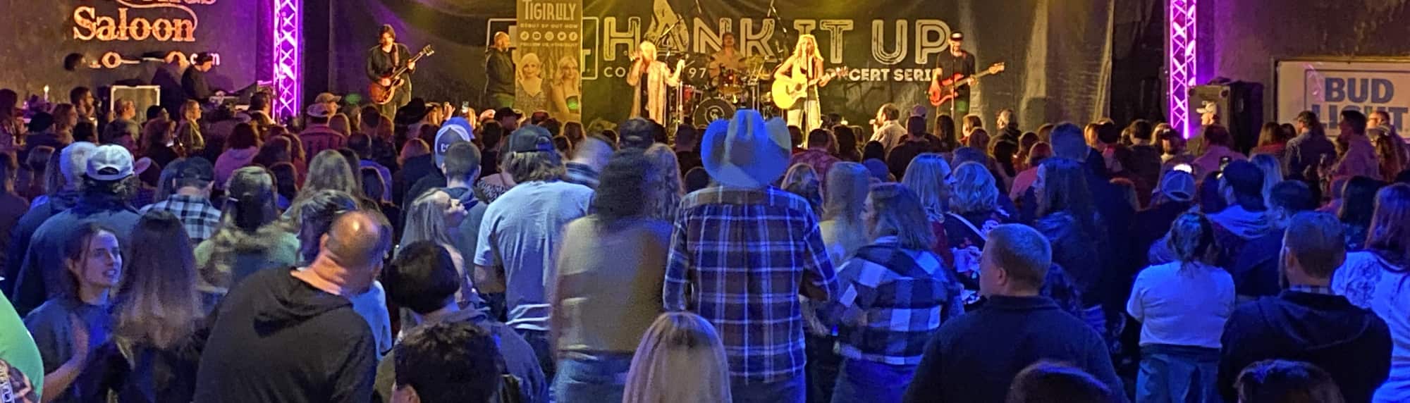 country concert with fans wearing cowboy hats Provo